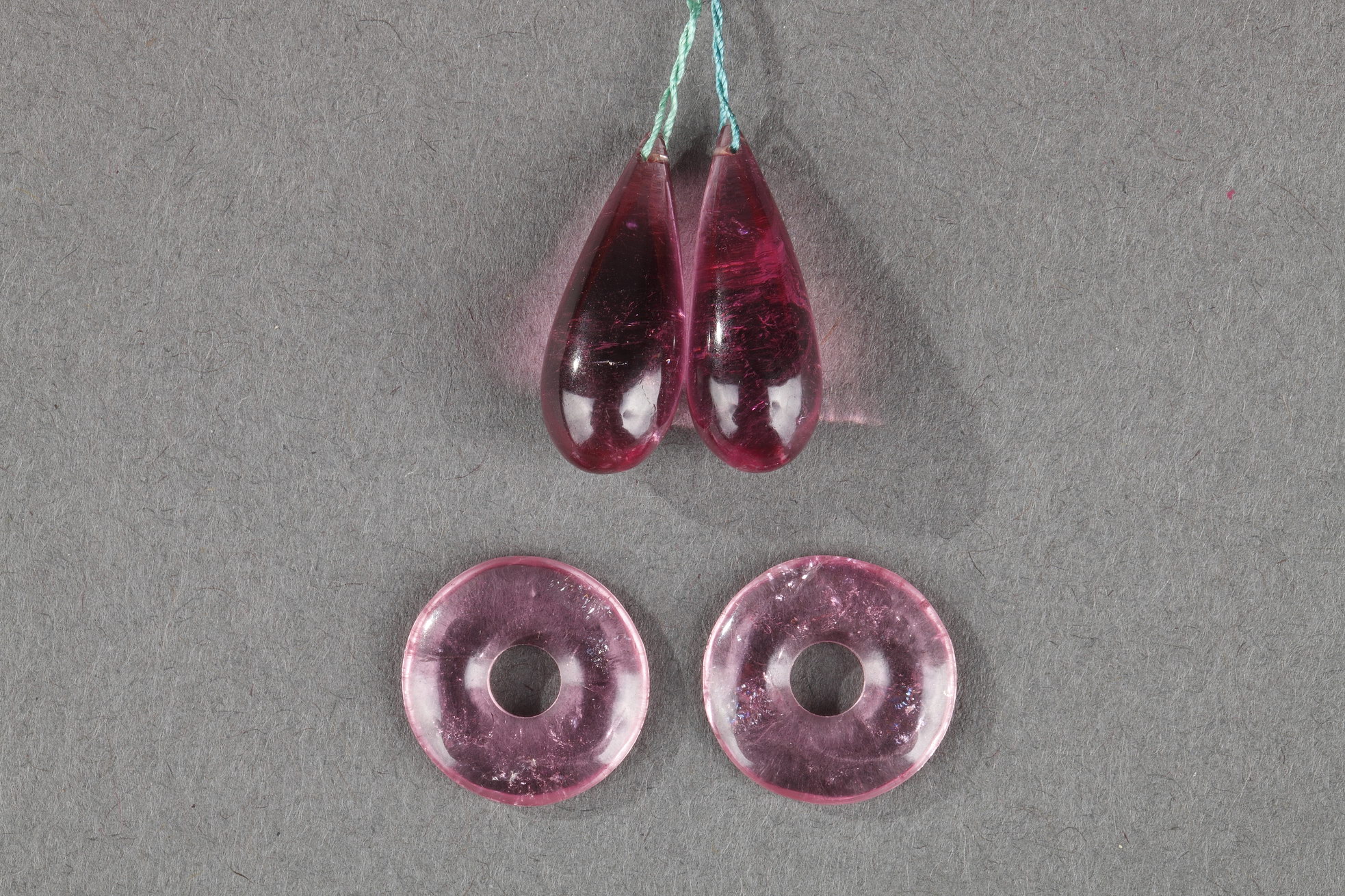 Four Chinese tourmaline pendant ,two drop-shapedand two ring-shaped